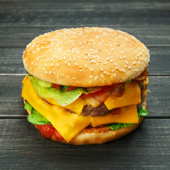 Meet and cheese burger at rustic wood
