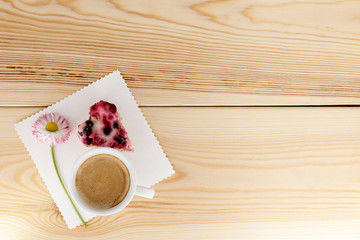 appetizing memorable and favorite/coffee with berry in the form of heart and daisy top view