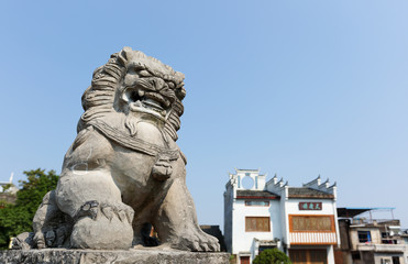Fototapeta premium Stone Lion at Daxu, Guilin. Dasu is an ancient town situated at the east bank of the Li River, 23 km (14.3 miles) southeast of Guilin City, China