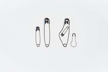 symbolic family made with safety pins