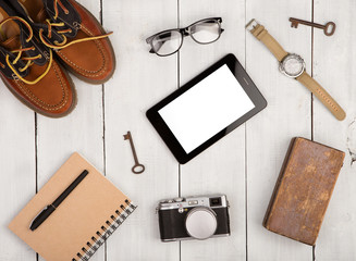 Travel concept - shoes, camera, tablet pc, notepad, watch, glass