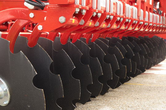 Red Disc Harrow Trailer for a Farming Tractor