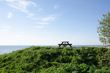 Bench and table at seaside