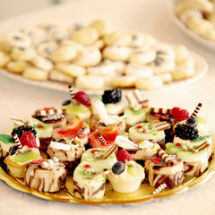 lovely collection of wedding sweet cakes on the table