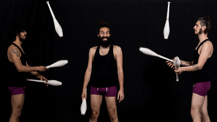 Circus jugglers during their batons performance