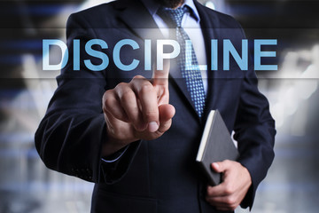 Businessman is pressing on virtual screen and selecting Discipline.