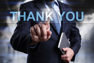 Businessman is pressing button on virtual screen and selecting Thank You.