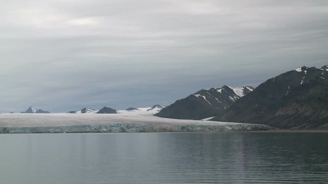 Coast of Svalbard. Glacier. View from the ship. Summertime