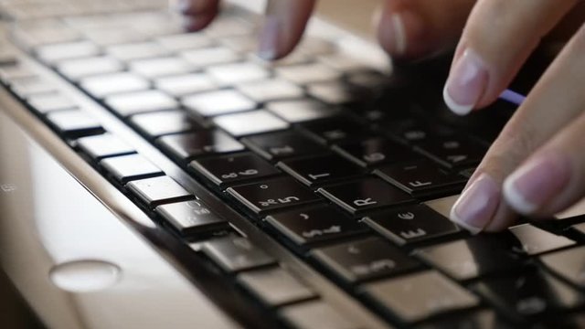 Business woman in office typing text on dark laptop keys close-up slow motion 1080p FullHD video - Modern office situation with fingers on computer keyboard 1920X1080 HD slow-mo footage 