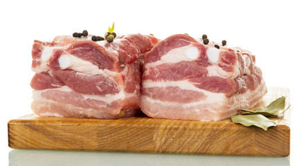 Raw pork ribs with spices isolated on white.