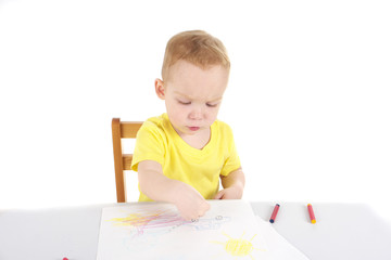 Little boy is drawing the picture