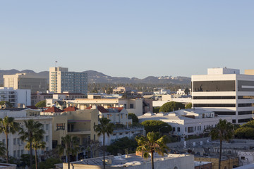 Fototapeta na wymiar House on a background of mountain range. City, mountain and blue sky in USA, Santa Monica. 