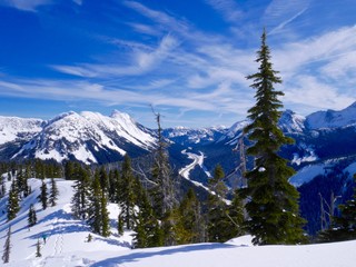 Snow Covered Mountains, Blue Sky, Clouds.
Coquihalla Highway from Yago Peak, Coquihalla Summit Recreation Area near Hope, British Columbia, Canada. 