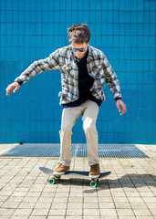 Skateboarder jumping in city