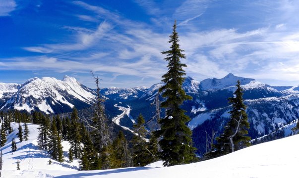 Snow Covered Mountains, Blue Sky, Clouds.
Coquihalla Highway from Yago Peak, Coquihalla Summit Recreation Area near Hope, British Columbia, Canada. 