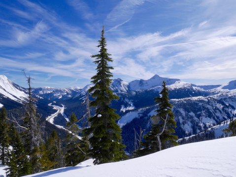 Snow Covered Mountains, Blue Sky, Clouds.
Coquihalla Highway from Yago Peak, Coquihalla Summit Recreation Area near Hope, British Columbia, Canada. 