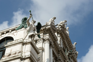 Fototapeta na wymiar Statues on the roof of Santa Maria del Giglio Venice