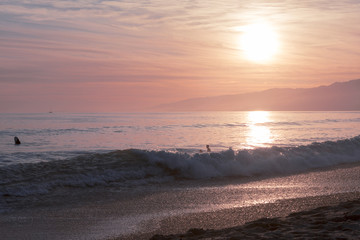 The Pacific ocean during sunset. Landscape with blue sea, the mountains and the dusk sky, the USA, Santa Monica. 