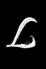 Letter L made of milk, isolated on black