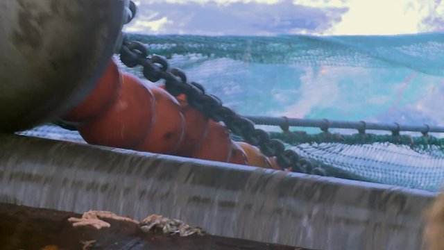 Details of the trawl, which rises out of the sea