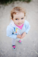 little girl with beautiful white teeth smiling at the camera