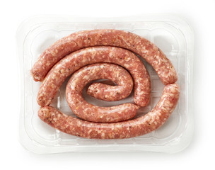 raw pork sausages in plastic try