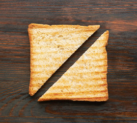Toasts on wooden background