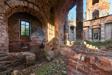 Fototapeta na wymiar The brick ruins of the interior of an abandoned temple.