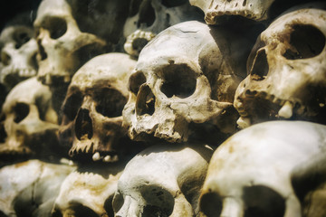 Human skulls stacked at the Killing Fields of Choeung Ek memorial in Phnom Penh, Cambodia.