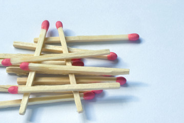 Wooden match sticks stacked one upon the other