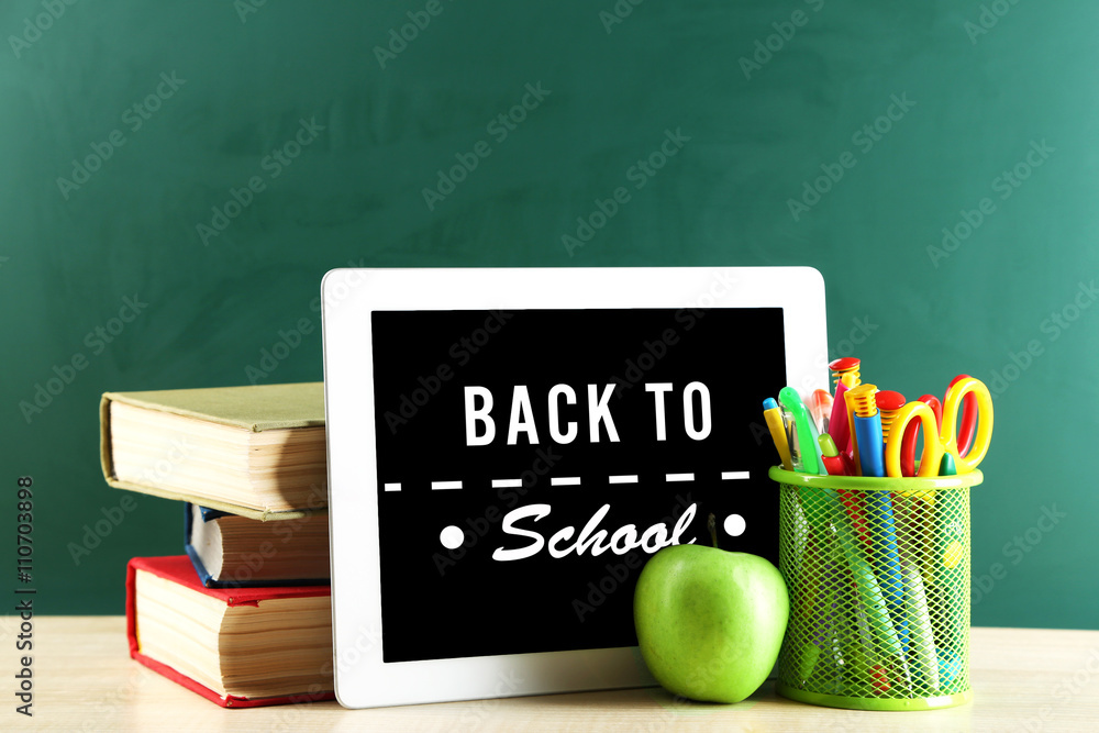 Wall mural Back to school message on screen of tablet-pc