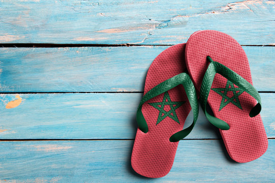 Thongs with flag of Morocco, on blue wooden boards