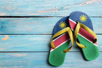 Thongs with flag of Namibia, on blue wooden boards
