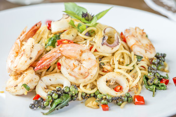 spaghetti seafood with spices, herbs of Thailand delicious food hot and spicy Thai as Italian mix style.