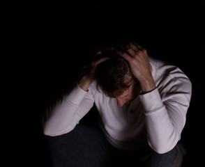 Man showing depression in dark background