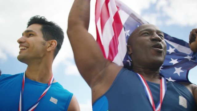  USA athletics team (disabled & able bodied) celebrate a victory