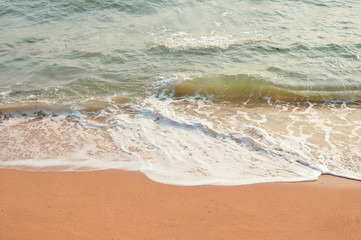 Wave of the sea on the sand
