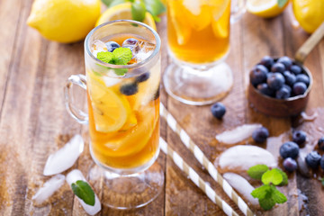 Iced tea with blueberries and lemon slices