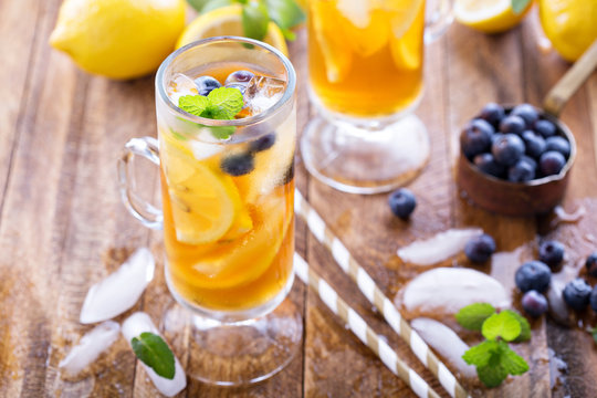 Iced tea with blueberries and lemon slices