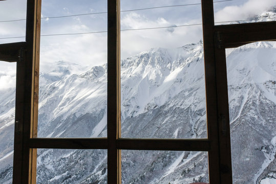 Fototapeta View at beautiful mountain landscape from house through window