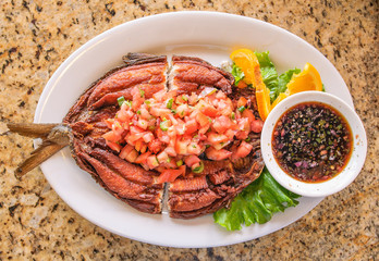 Deep Fried Marinated Milkfish (Bangus) with garlic vinegar sauce, Philippine style.