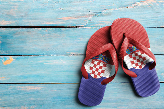 Thongs with flag of Croatia, on blue wooden boards