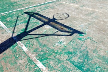 Fototapeta na wymiar Concrete basketball court with shadow hoop