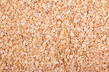 Uncooked oatmeal close-up for the preparation dietary dishes. Texture.