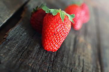 fresh strawberries on a wooden background