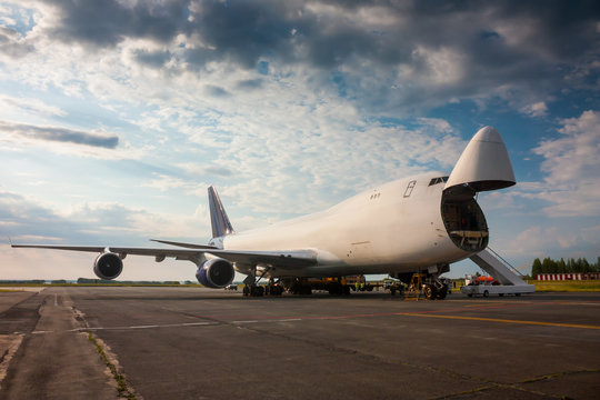 Fototapeta Unloading wide-body cargo aircraft