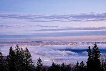 Vancouver City and Lions Gate Bridge Covered with Fog at Dusk. Vancouver, British Columbia, Canada. View from Cypress Mountain. 