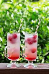 Pink raspberry lemonade in tall glasses