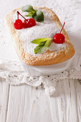 Delicate Austrian dessert Salzburger Nockerln with cherries and mint. vertical
