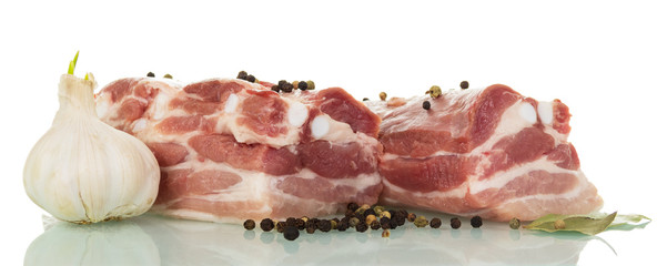 Fragments  fresh raw pork meat and spices isolated on white.